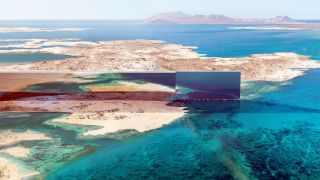 Das Bild zeigt ein Rendering der Stadt The Line von oben.